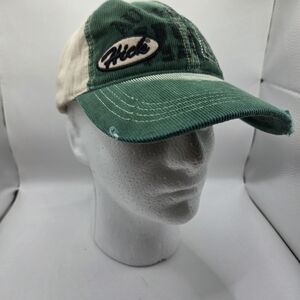 Green and beige corduroy baseball cap with a "Hick" logo